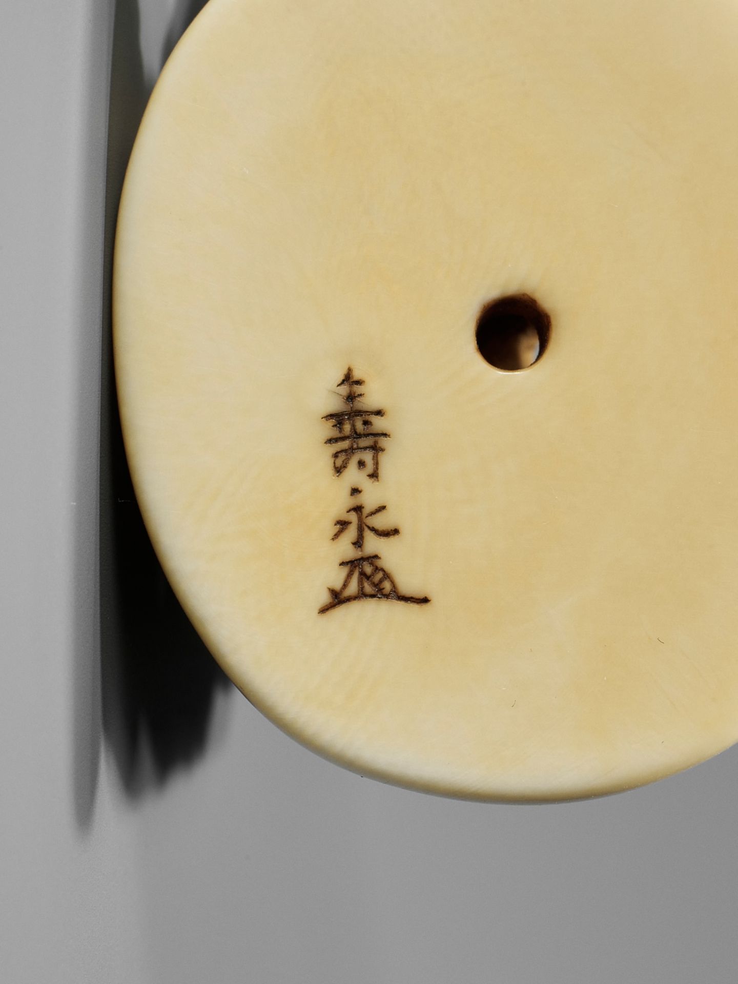 TOSHINAGA: AN IVORY NETSUKE OF A SHISHI WITH YOUNG - Image 11 of 12