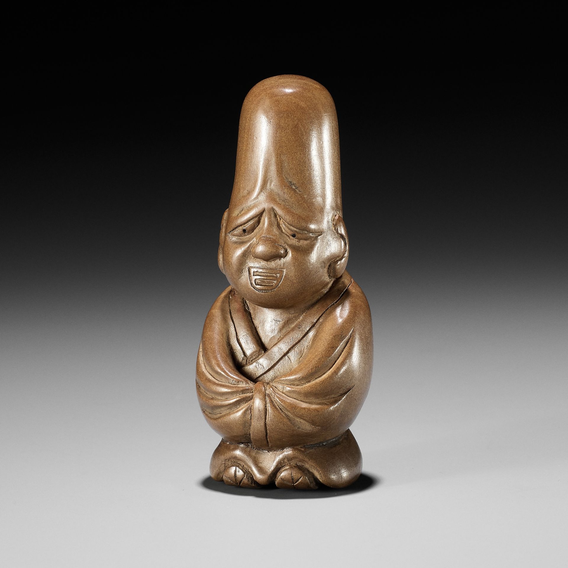 ITTEI: AN AMUSING WOOD NETSUKE OF FUKUROKUJU