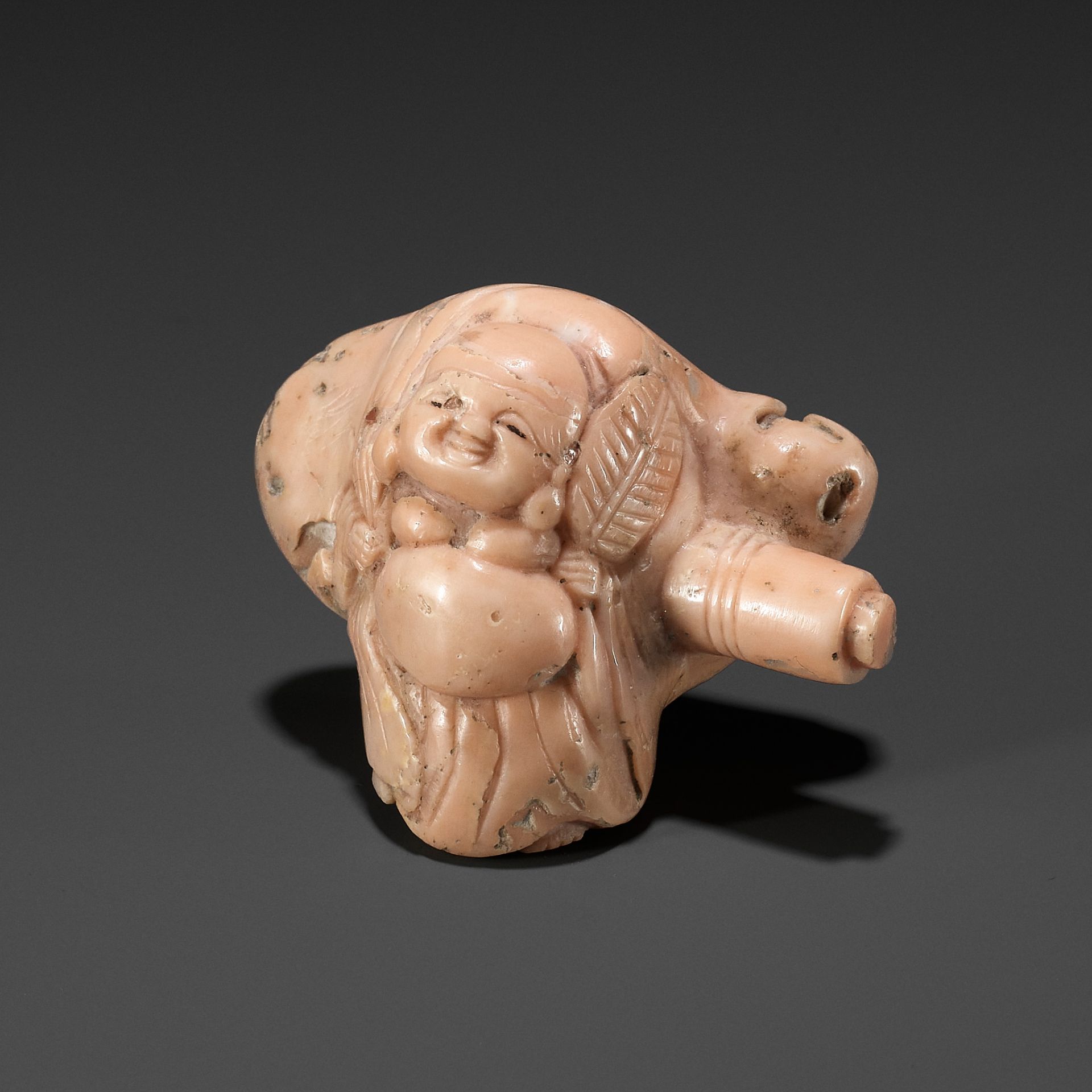 A CORAL NETSUKE OF HOTEI