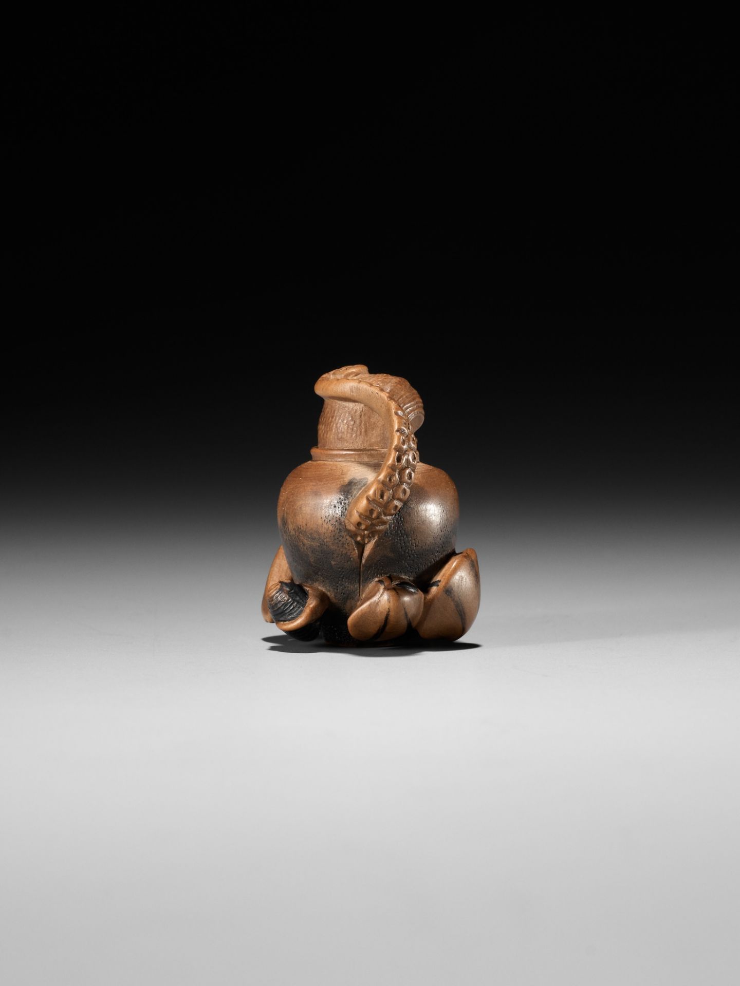 TOMONOBU: A STAINED WOOD NETSUKE OF A TRAPPED OCTOPUS (TAKO TSUBO) - Image 7 of 10