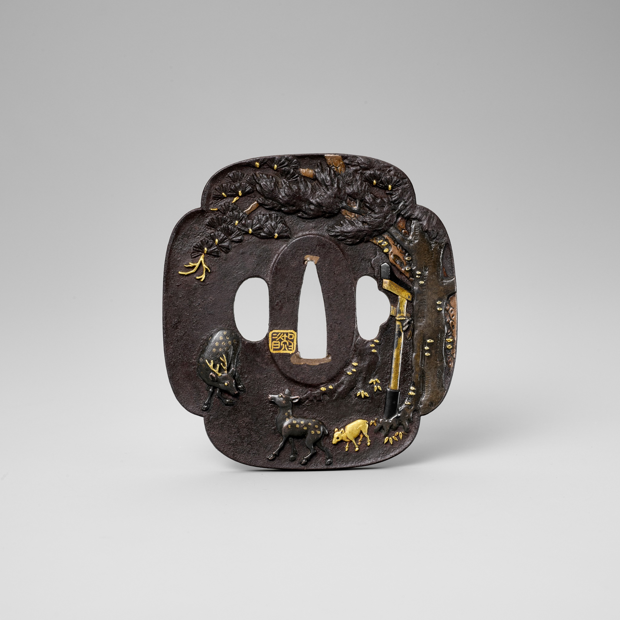 SHOZUI: A HAMANO SCHOOL IRON TSUBA WITH DEER, TORII GATE AND PINE