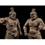 AN EXCEPTIONAL PAIR OF MONUMENTAL WOOD FIGURES OF NIO GUARDIANS