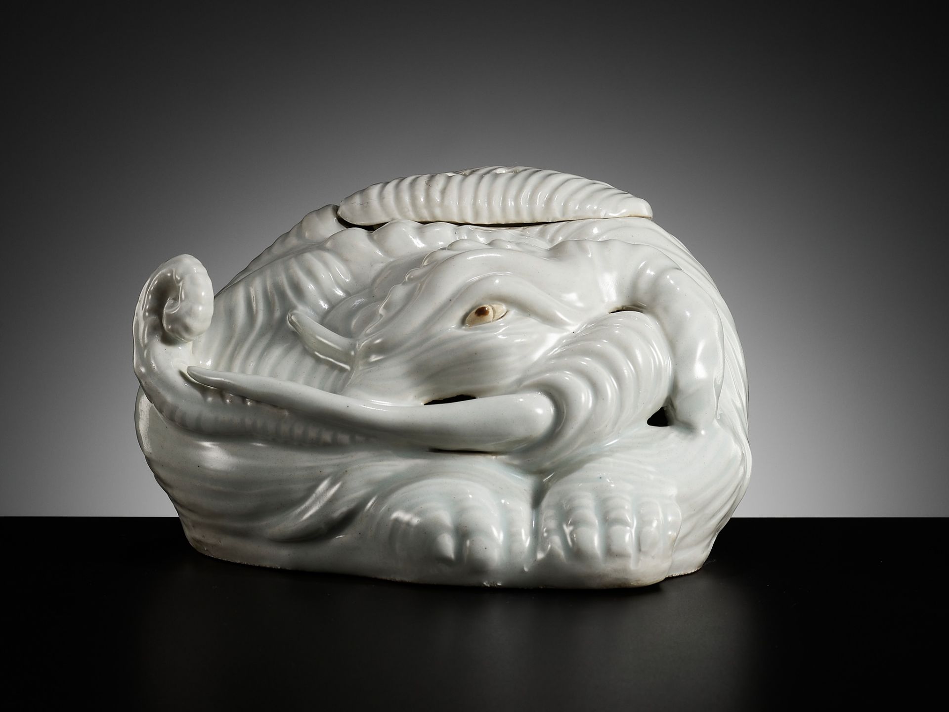 A PALE CELADON GLAZED ELEPHANT-FORM KORO (INCENSE BURNER AND COVER)