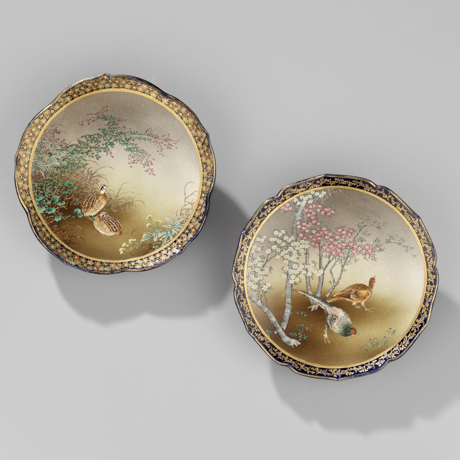 KINKOZAN: A PAIR OF COBALT-BLUE GROUND SATSUMA CERAMIC DISHES WITH PHEASANTS AND QUAILS