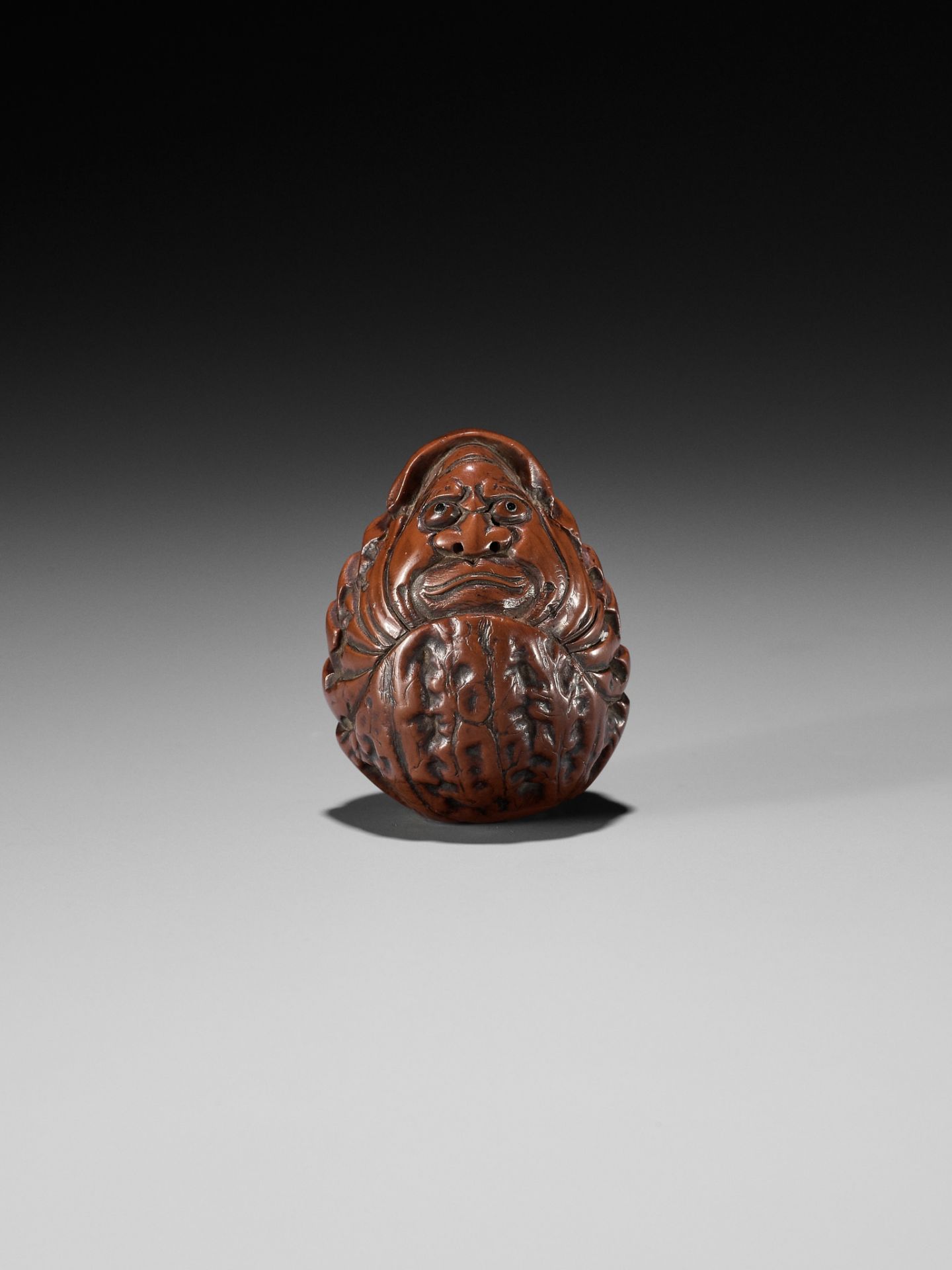 HIDARI ISSAN: A KURUMI (WALNUT) NETSUKE OF A ROLY POLY DARUMA - Image 2 of 10