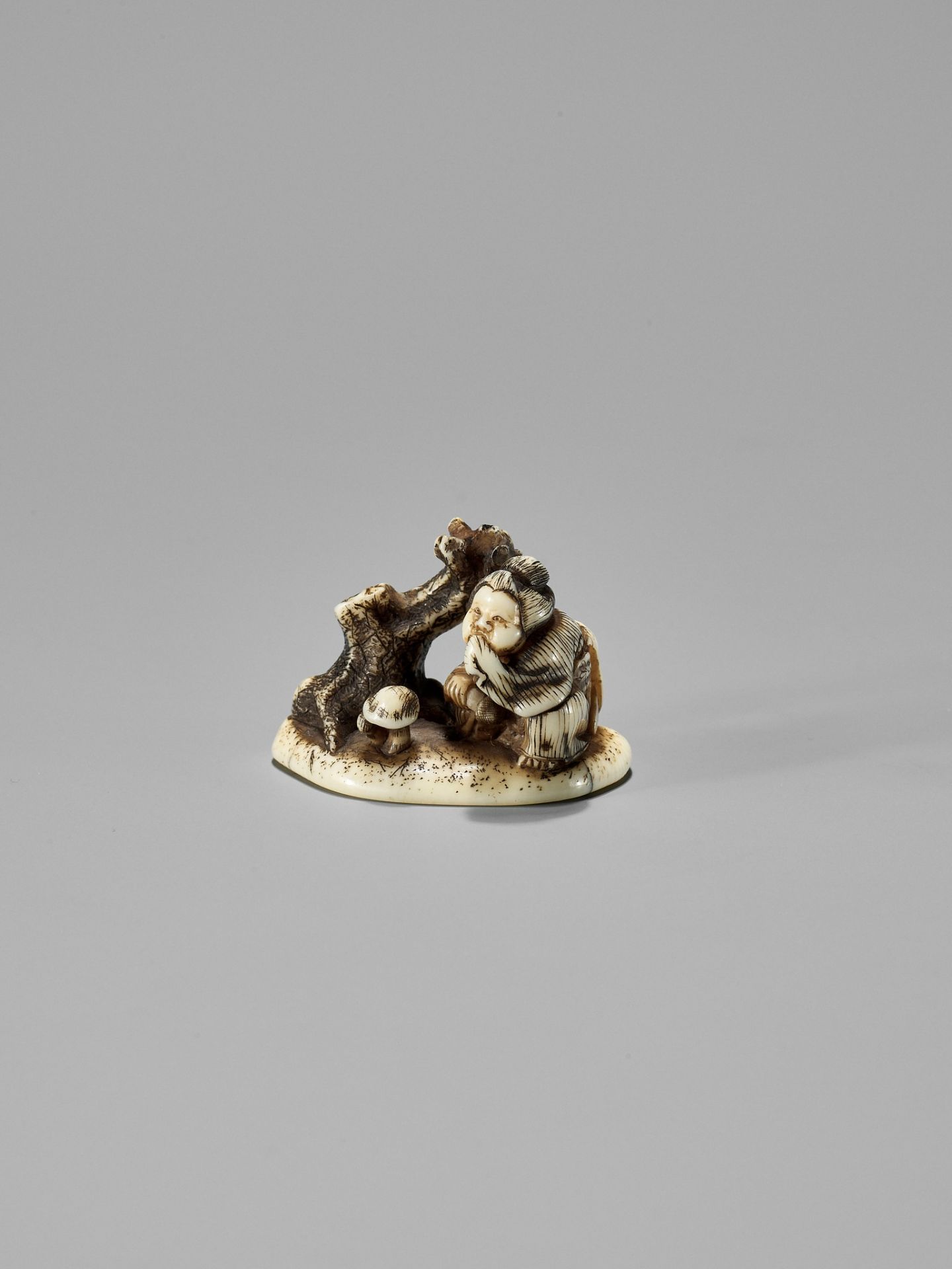 SHIGEMASA: AN AMUSING OSAKA SCHOOL SHUNGA IVORY NETSUKE OF OKAME WITH MUSHROOM - Image 3 of 12