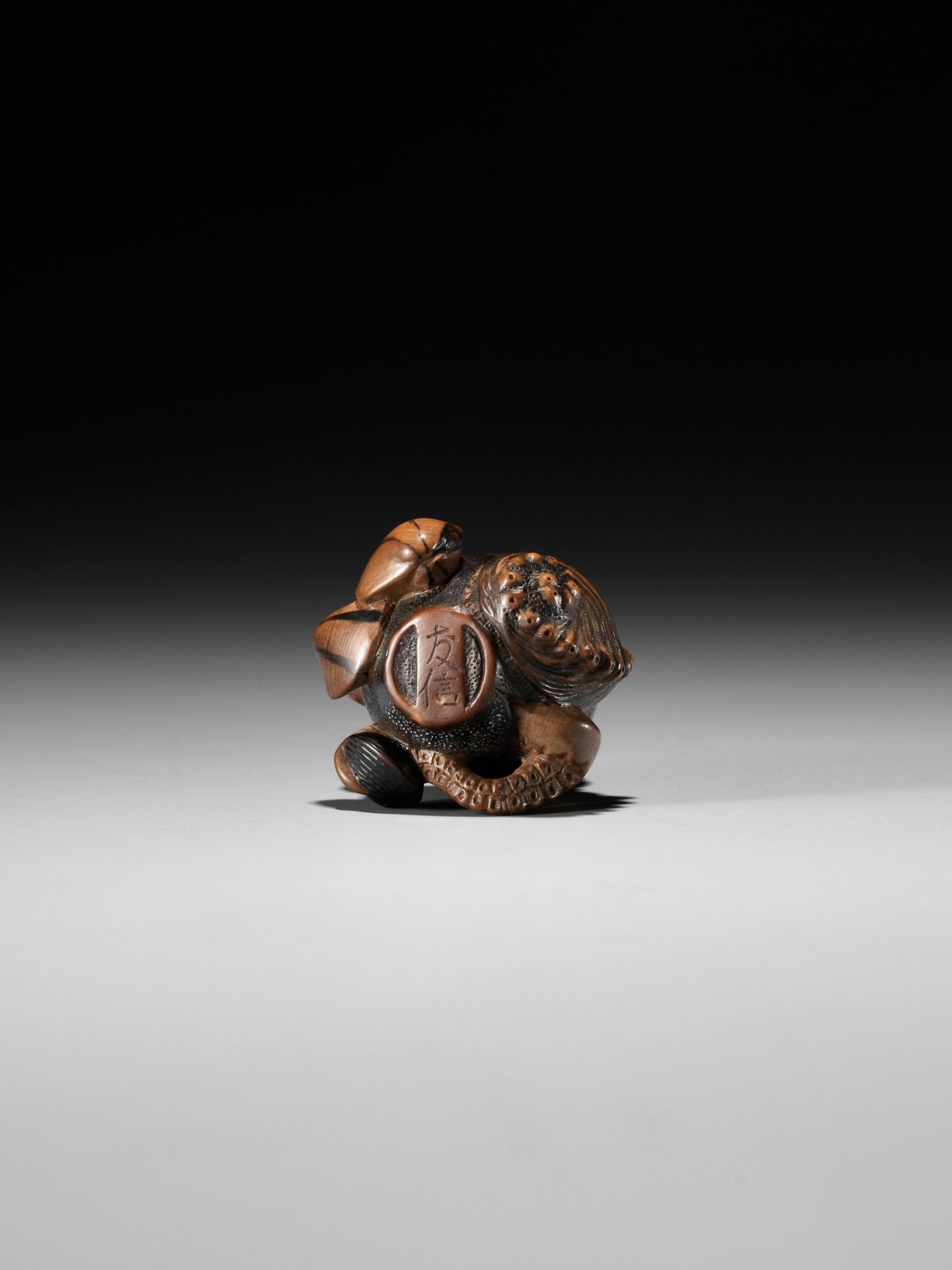 TOMONOBU: A STAINED WOOD NETSUKE OF A TRAPPED OCTOPUS (TAKO TSUBO) - Image 2 of 10