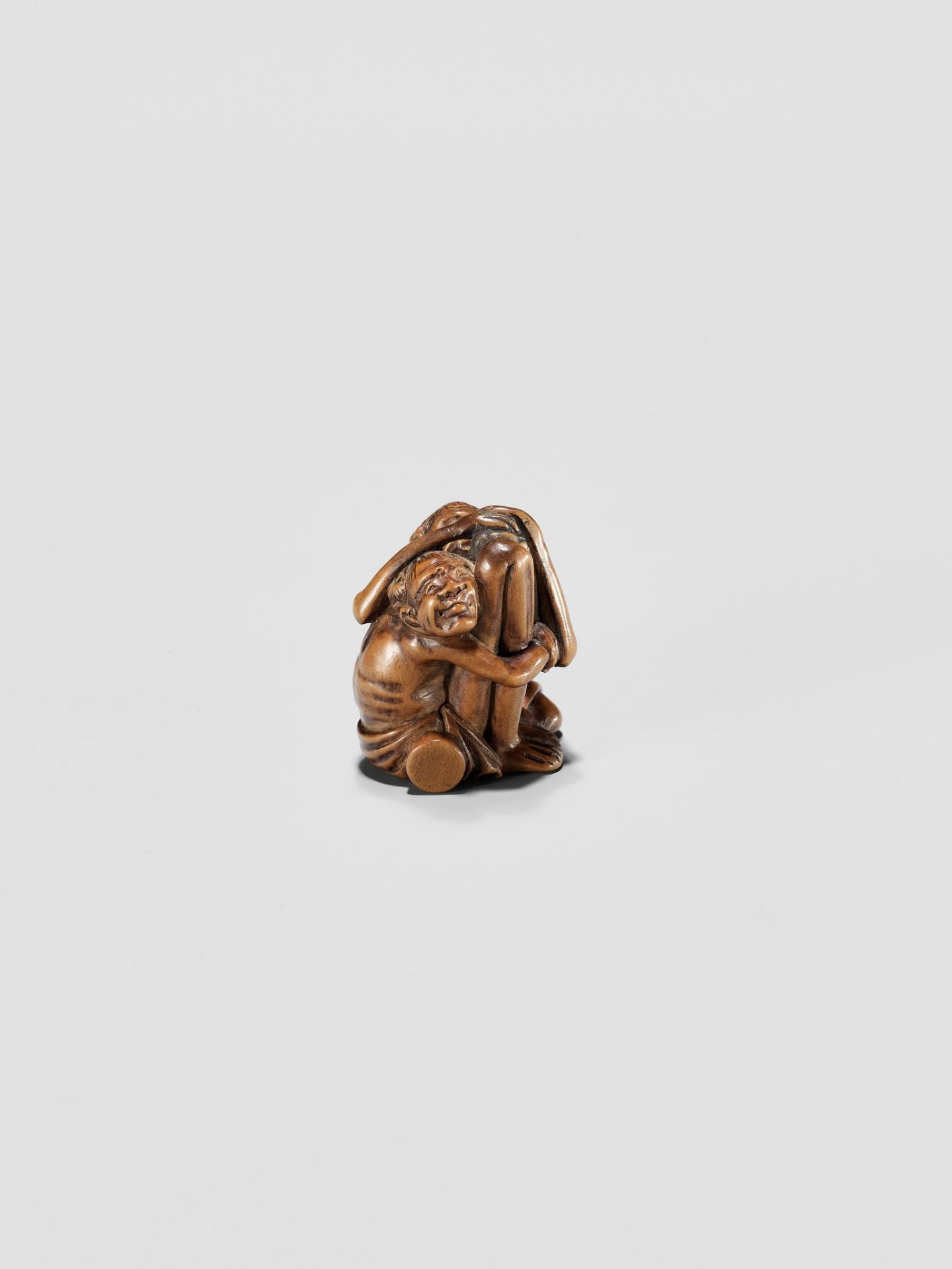 A TOMOCHIKA SCHOOL WOOD NETSUKE OF ASHINAGA AND TENAGA - Image 2 of 10