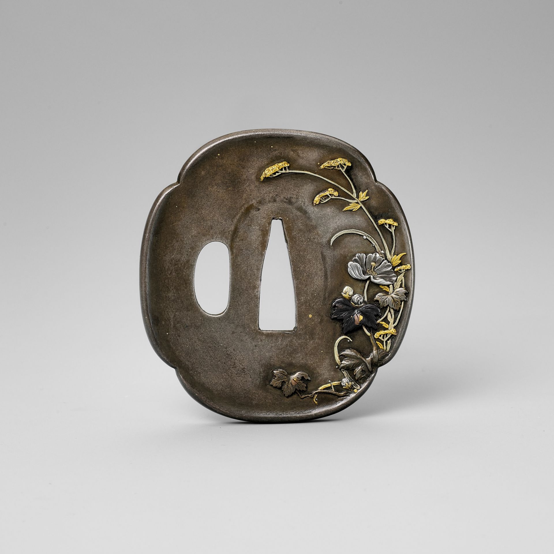 RYUMEISHI KAZUHIDE: A FINE SHIBUICHI TSUBA WITH SPRING FLOWERS AFTER RAIN