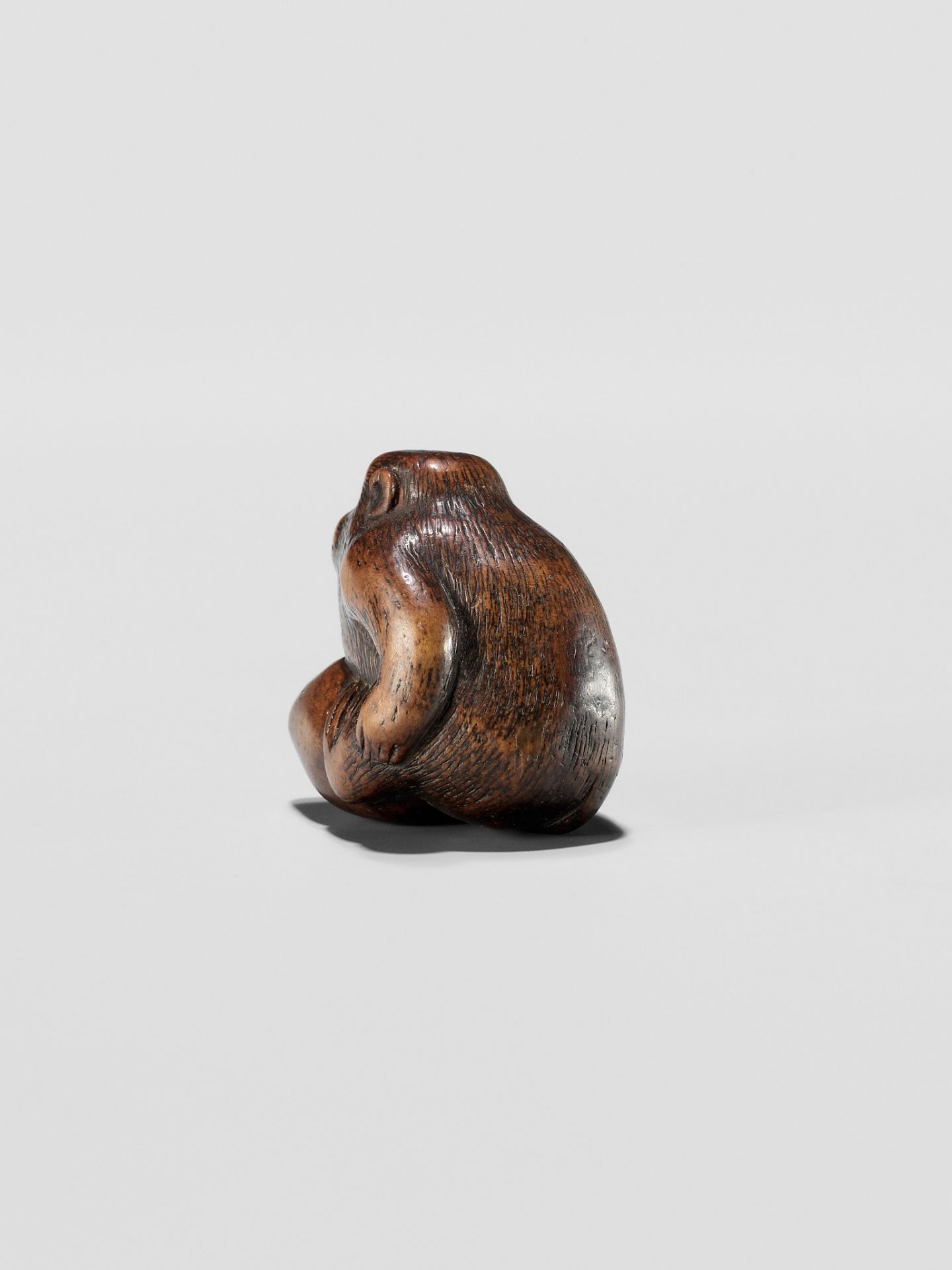 A WOOD NETSUKE OF A MONKEY EATING A PEACH, ATTRIBUTED TO MIWA - Image 7 of 12