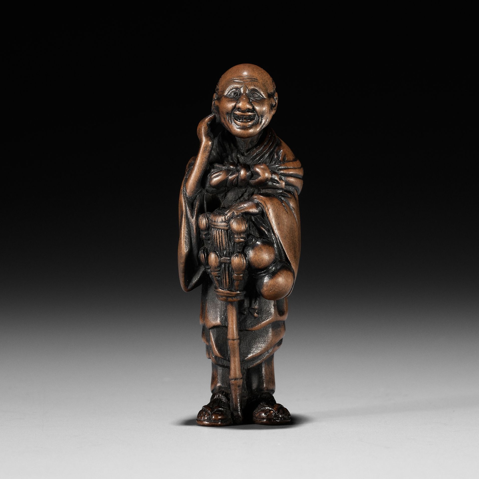 ROKKO: A FINE WOOD NETSUKE OF A CHASEN (TEA WHISK) VENDOR