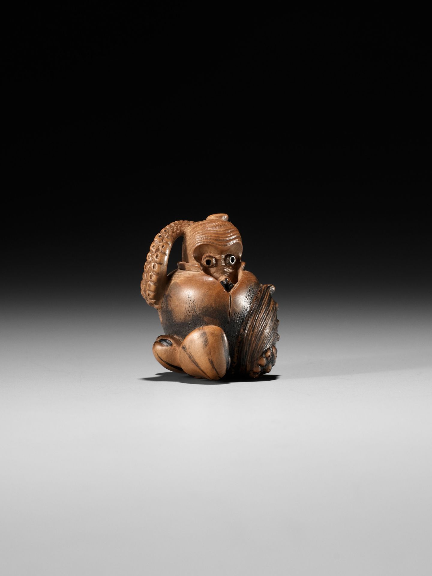 TOMONOBU: A STAINED WOOD NETSUKE OF A TRAPPED OCTOPUS (TAKO TSUBO) - Image 8 of 10