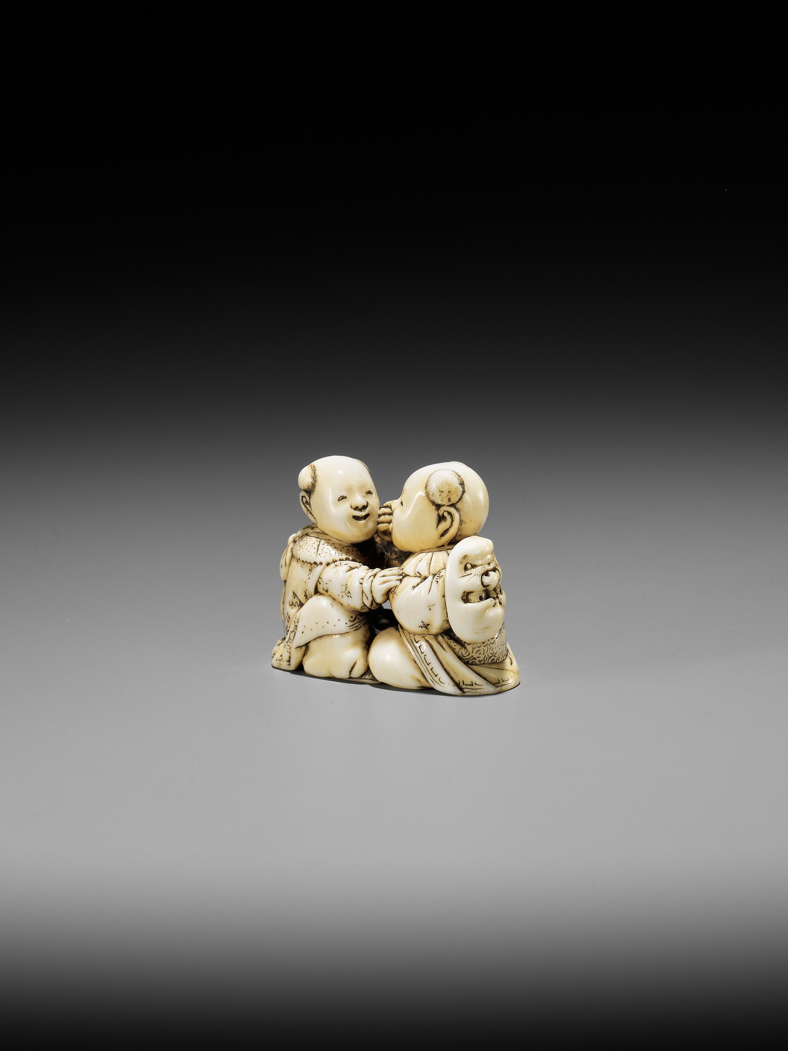 TADACHIKA: AN IVORY NETSUKE OF TWO PLAYING KARAKO - Image 3 of 10