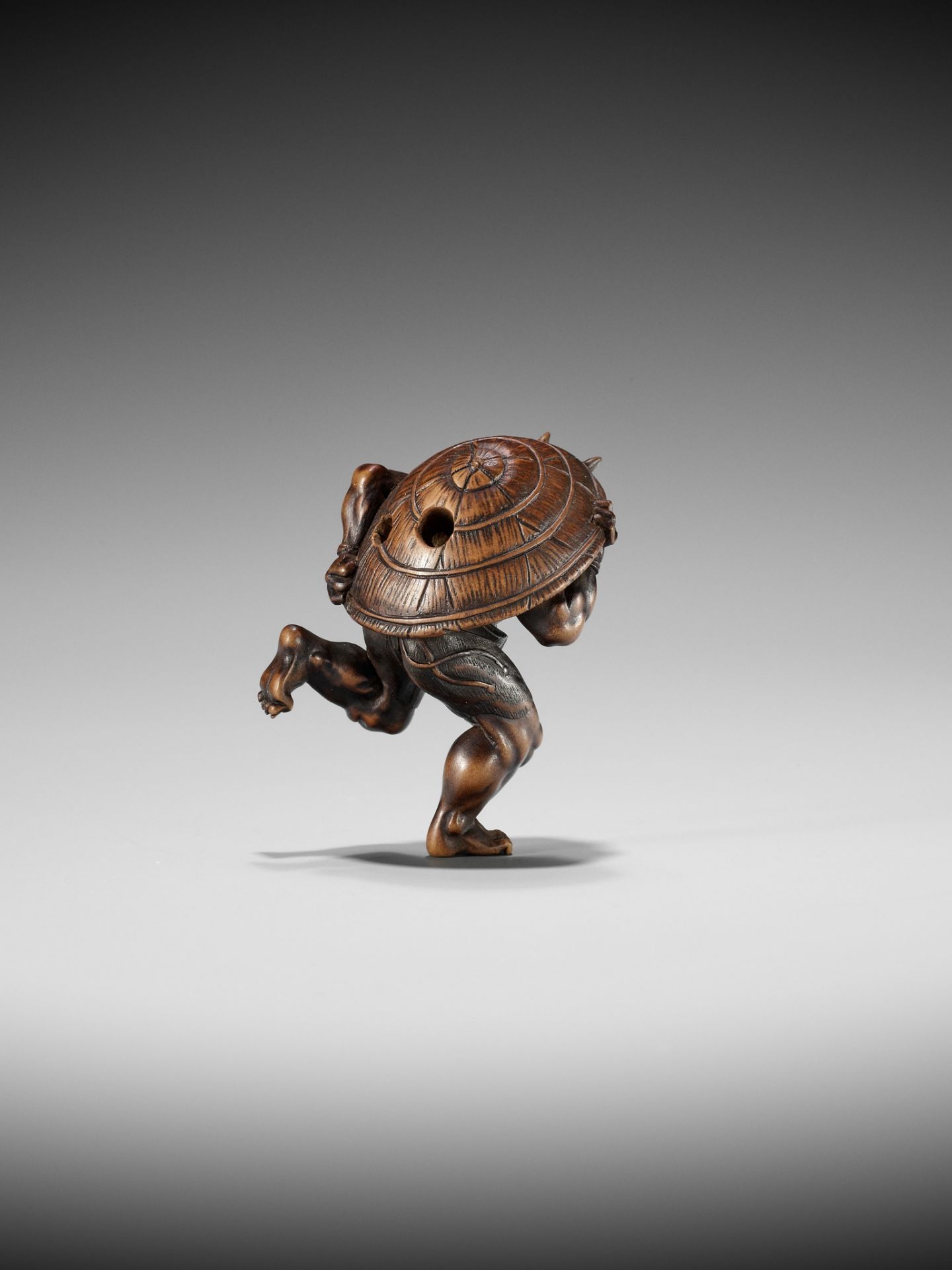 A WOOD NETSUKE OF AN ONI AT SETSUBUN, ATTRIBUTED TO ROKKO - Image 2 of 10