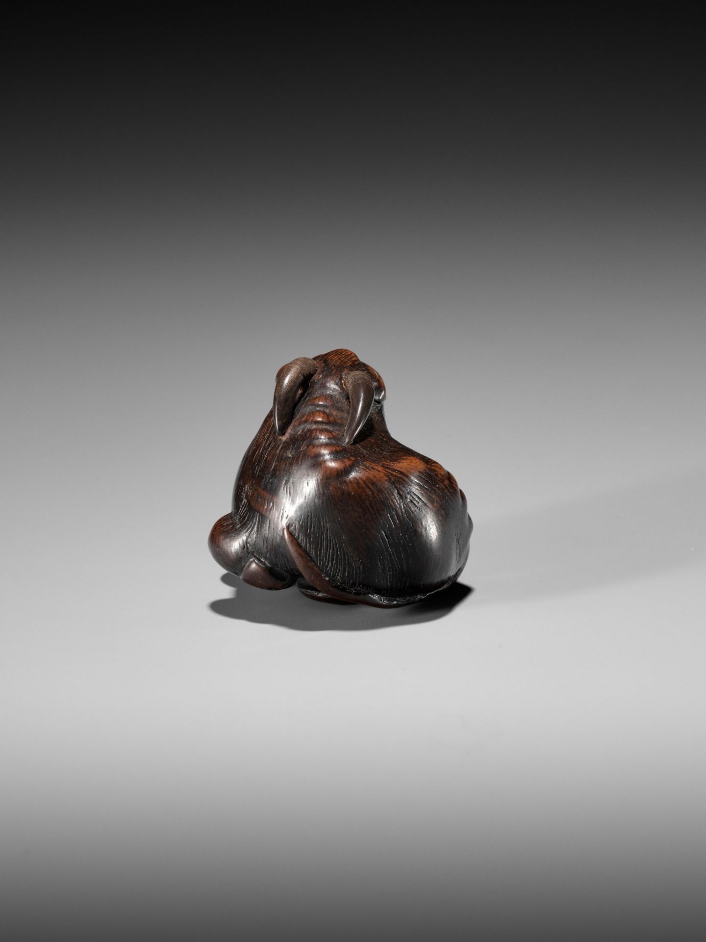 MASAKAZU: A FINE WOOD NETSUKE OF A RECUMBENT GOAT - Image 6 of 8