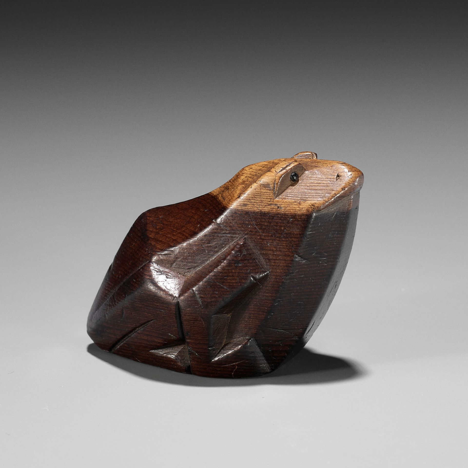 SUKENAGA: A RARE ITTOBORI YEW WOOD NETSUKE OF A CROUCHING FROG