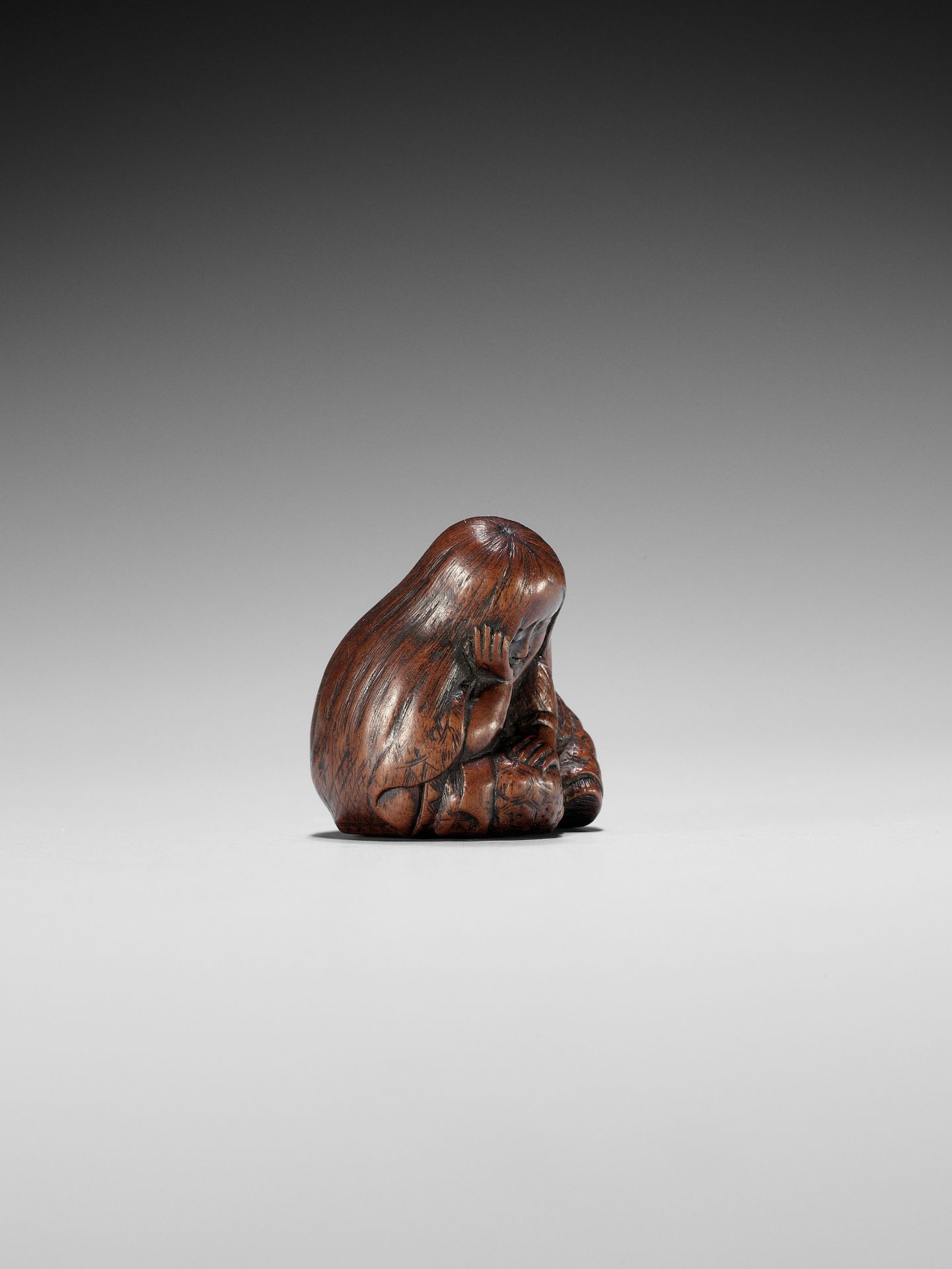 TOSHIKAZU: A NAGOYA SCHOOL WOOD NETSUKE OF A SEATED SLEEPING SHOJO - Image 2 of 12