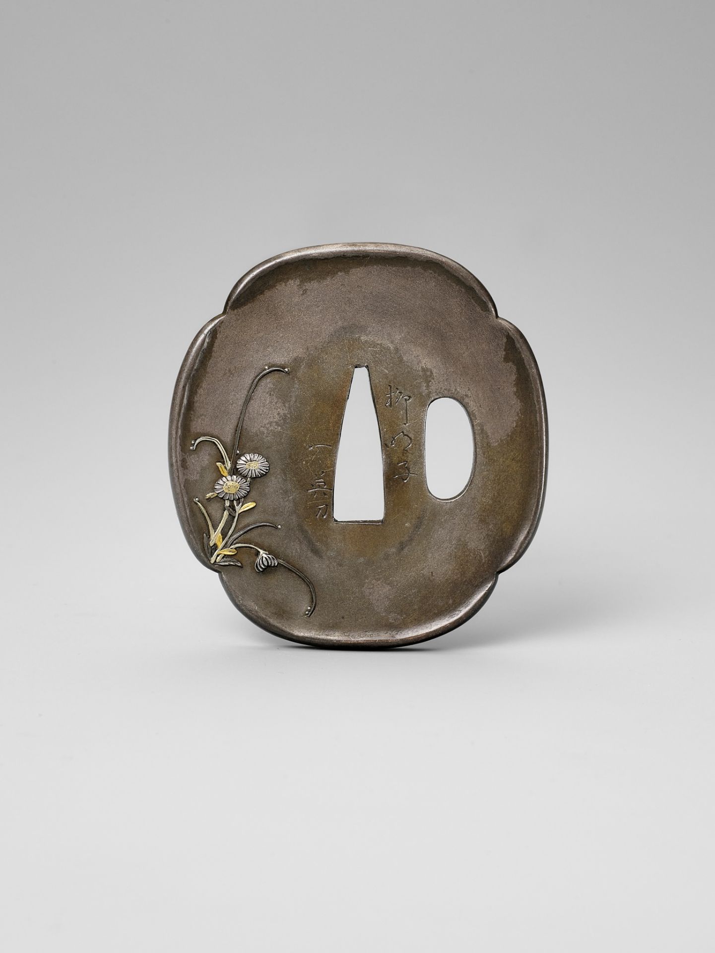 RYUMEISHI KAZUHIDE: A FINE SHIBUICHI TSUBA WITH SPRING FLOWERS AFTER RAIN - Image 2 of 4