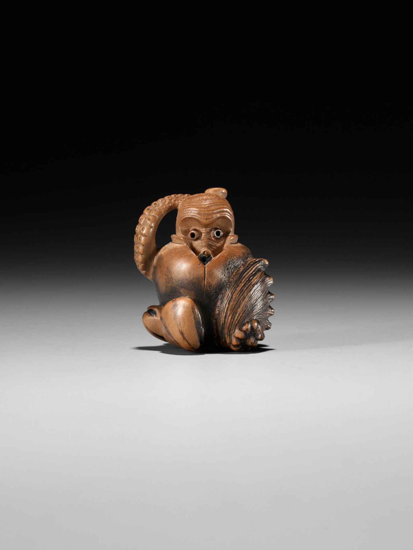 TOMONOBU: A STAINED WOOD NETSUKE OF A TRAPPED OCTOPUS (TAKO TSUBO) - Image 4 of 10