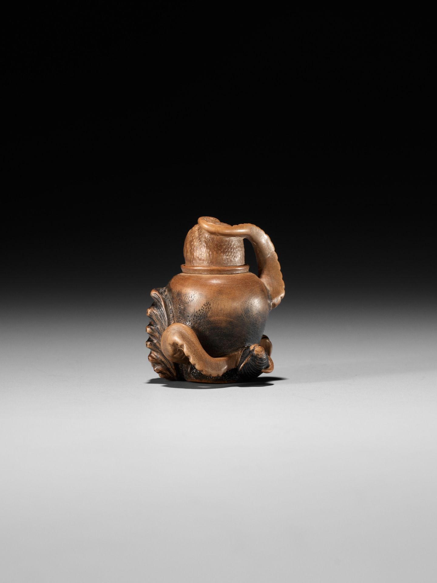 TOMONOBU: A STAINED WOOD NETSUKE OF A TRAPPED OCTOPUS (TAKO TSUBO) - Image 6 of 10