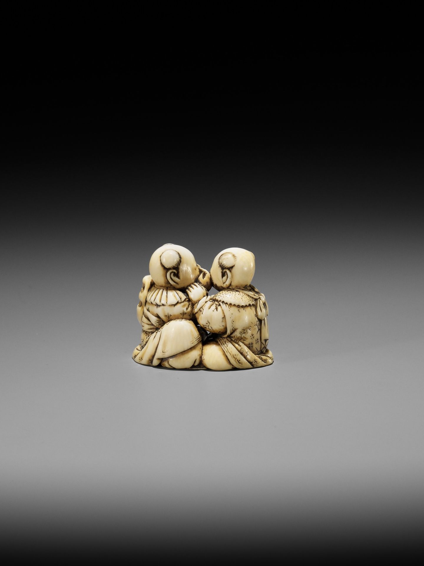 TADACHIKA: AN IVORY NETSUKE OF TWO PLAYING KARAKO - Image 2 of 10