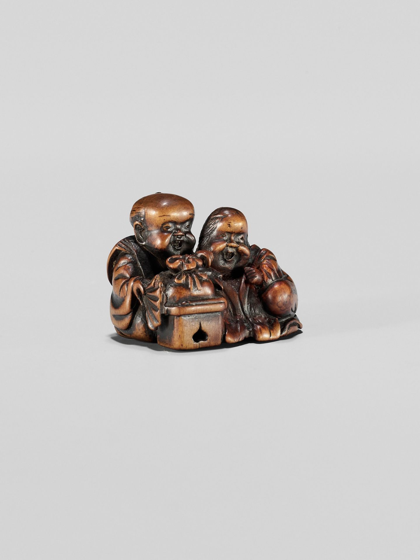 HIDESADA: A FINE WOOD NETSUKE OF OKAME AND FUKUSUKE - Image 10 of 12