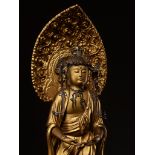 A GILT WOOD FIGURE OF KANNON BOSATSU