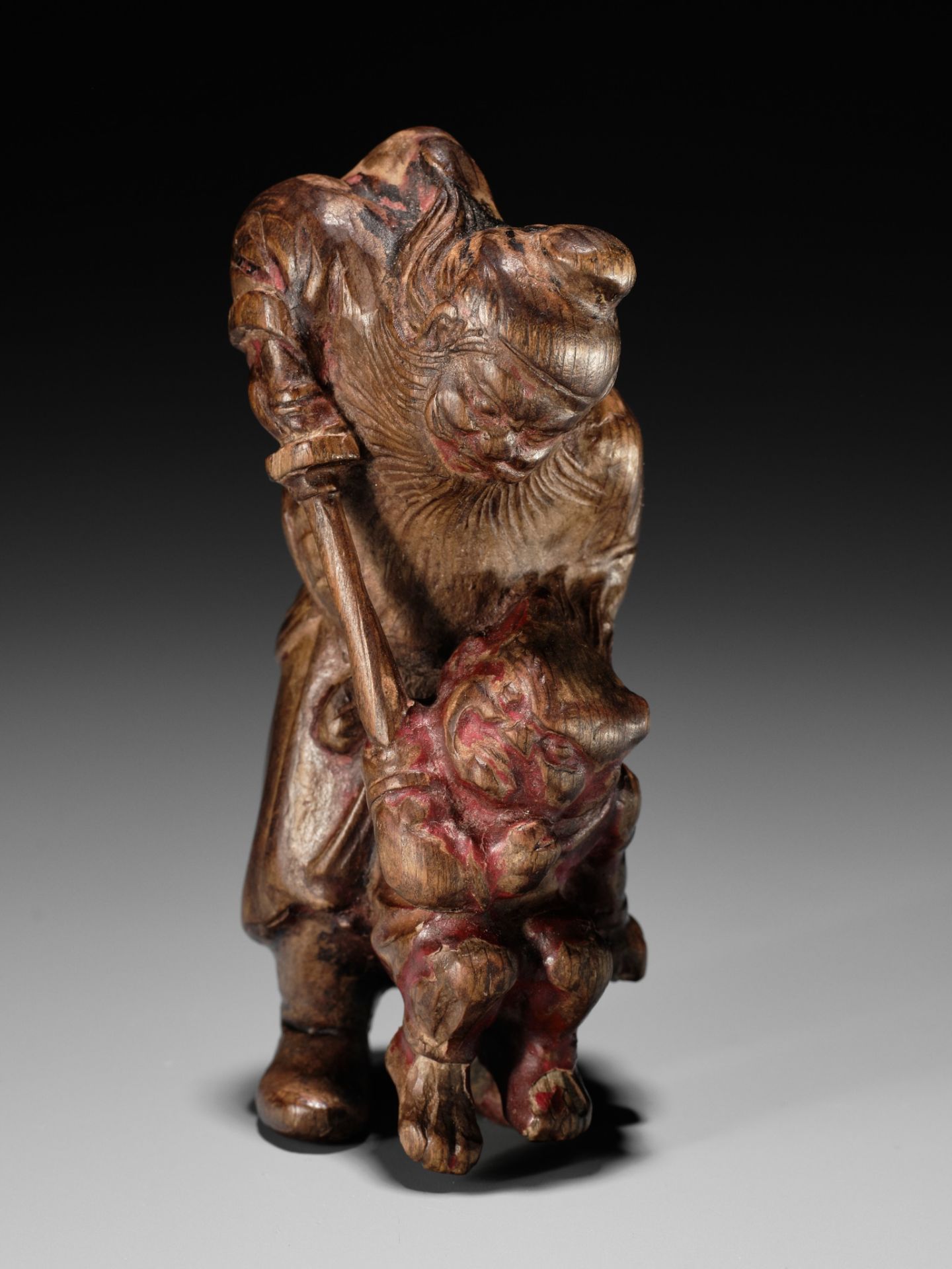 A POWERFUL SAISHIKI NETSUKE OF SHOKI AND ONI, STYLE OF YOSHIMURA SHUZAN