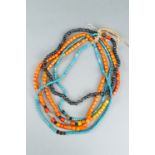 FIVE NAGALAND MULTI-COLORED GLASS NECKLACES STRUNG TOGETHER, c. 1900s