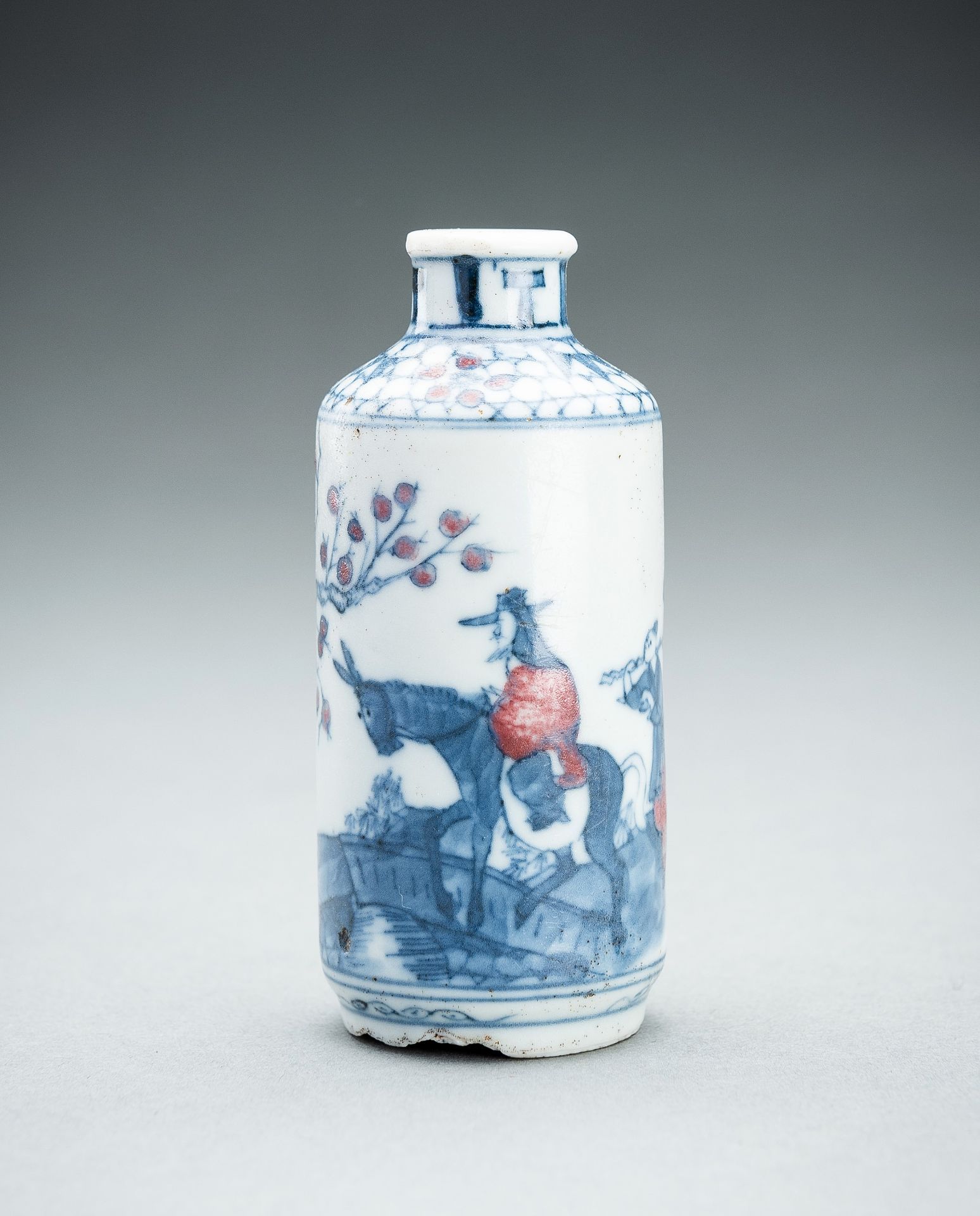 A BLUE AND IRON-RED 'MENG HAORAN' SNUFF BOTTLE, QING