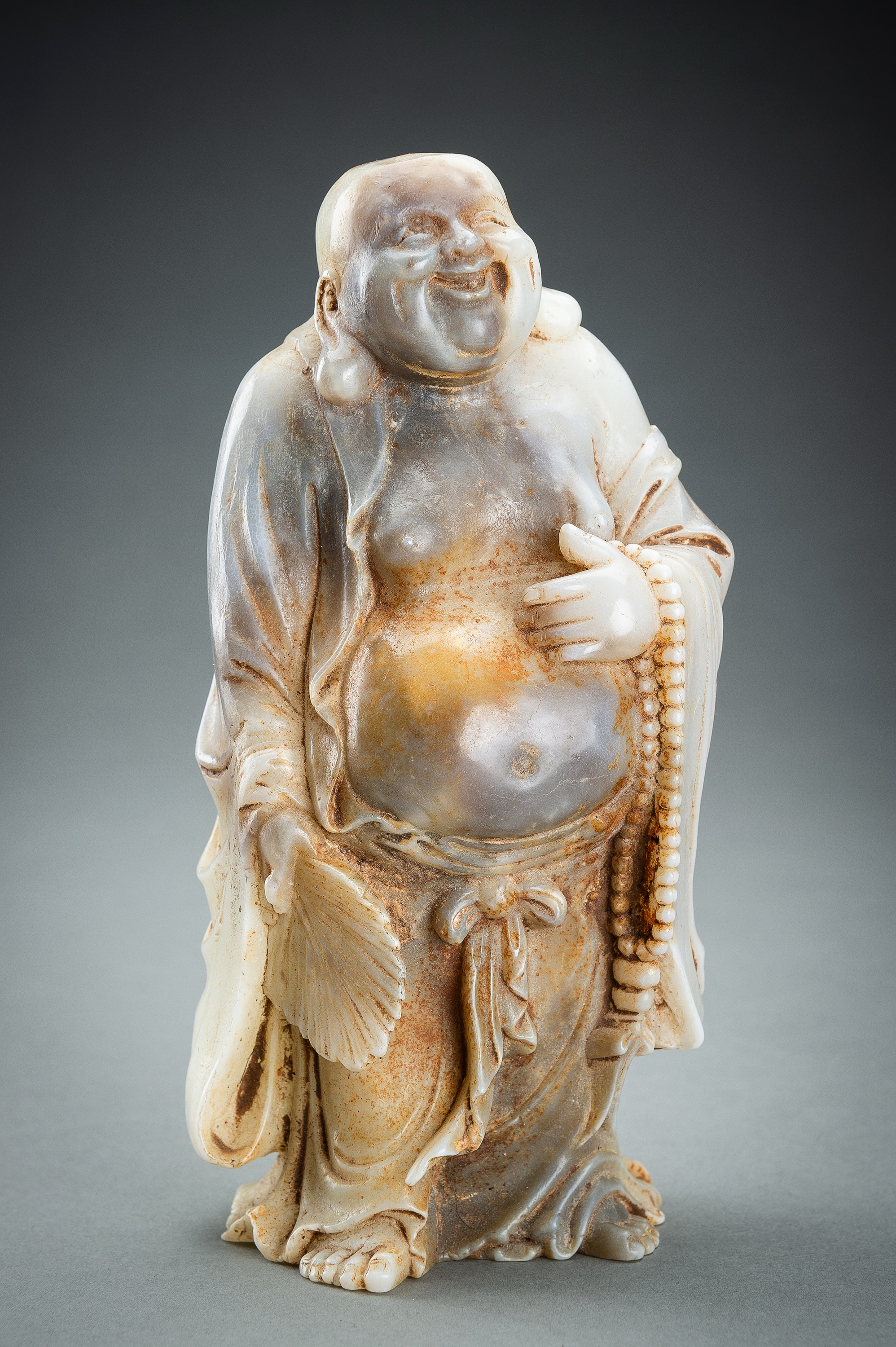 AN AGATE FIGURE OF BUDAI