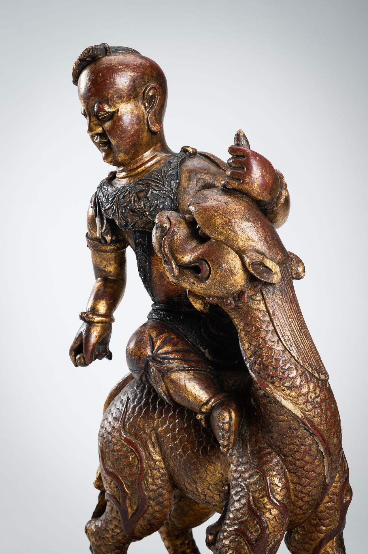 A VERY LARGE GILT-LACQUERED WOOD STATUE OF YOUNG BUDDHA RIDING QILIN - Image 9 of 19