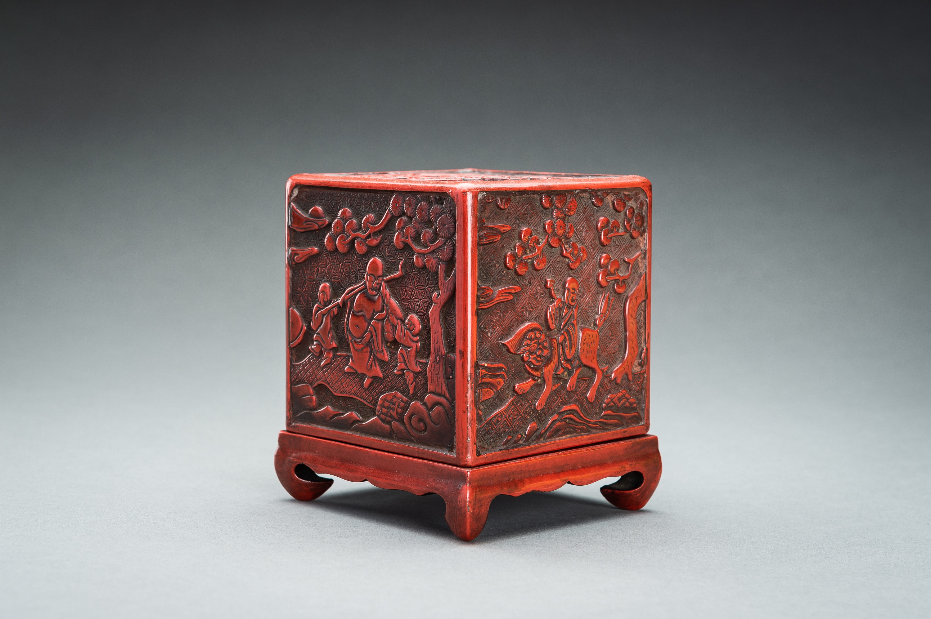 A CINNABAR LACQUER 'IMMORTALS AND BUDAI' BOX AND COVER, QING - Image 6 of 14