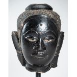 A LARGE LACQUERED SANDSTONE HEAD OF BUDDHA, 16th - 17th CENTURY