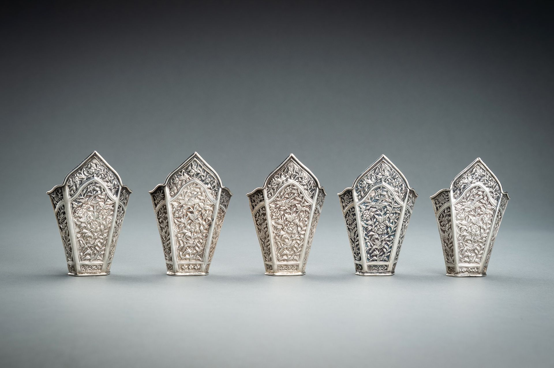 A GROUP OF FIVE EMBOSSED SILVER BETEL LEAF HOLDERS, c. 1900s - Image 9 of 19