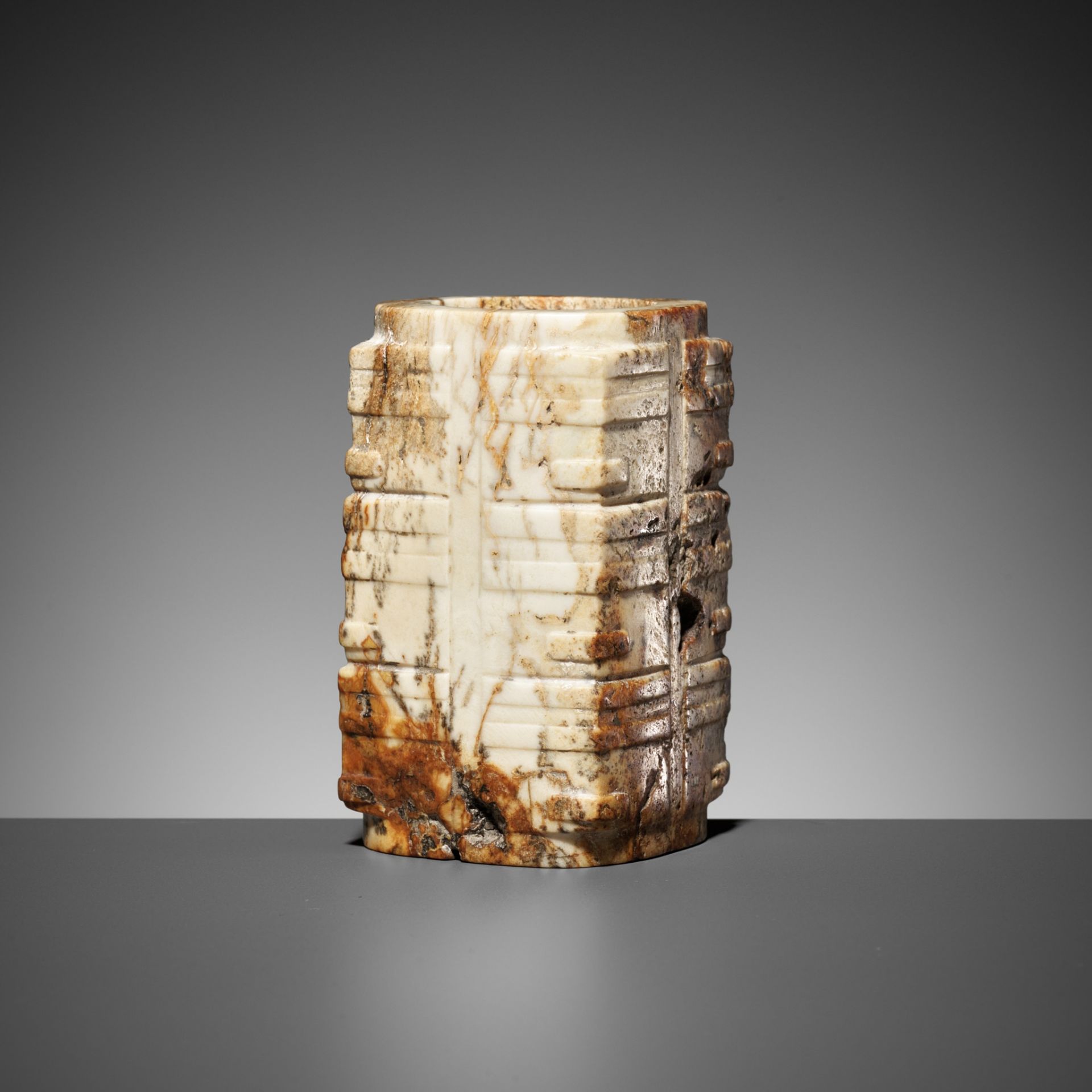 A THREE-TIERED WHITE AND RUSSET JADE CONG, LATE LIANGZHU CULTURE