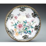 A CANTON ENAMEL 'FLOWERS AND BUTTERFLIES' DISH, QING