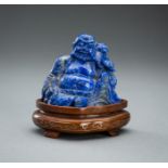 A LAPIS LAZULI FIGURE OF BUDAI WITH CHILD, 19TH CENTURY