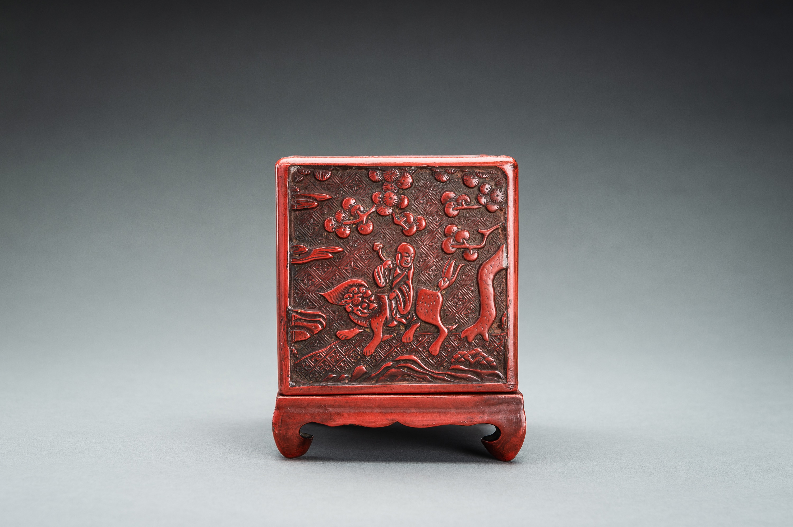 A CINNABAR LACQUER 'IMMORTALS AND BUDAI' BOX AND COVER, QING - Image 4 of 14