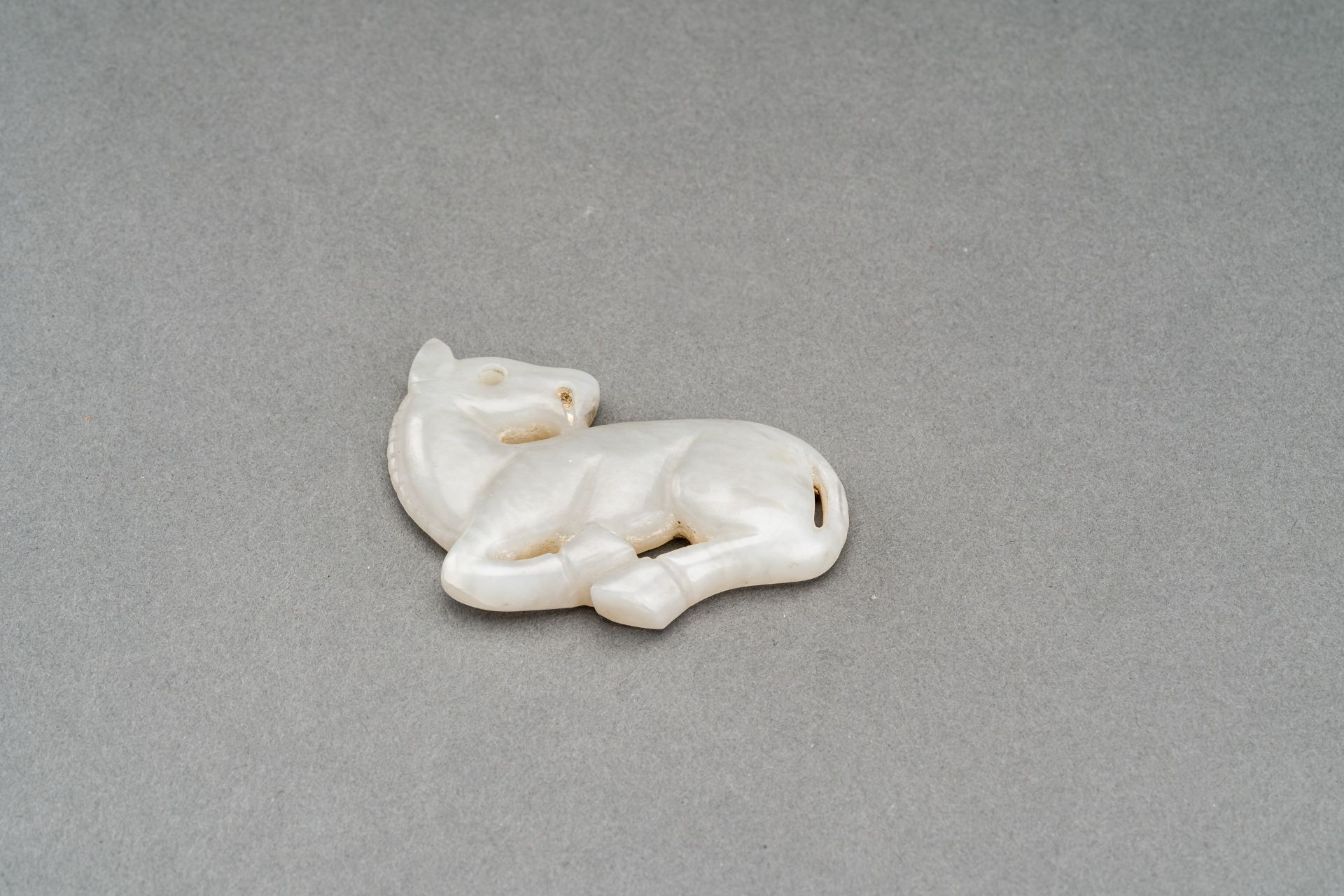 A GRAY JADE PENDANT OF A RECUMBENT HORSE, c. 1920s - Image 5 of 7