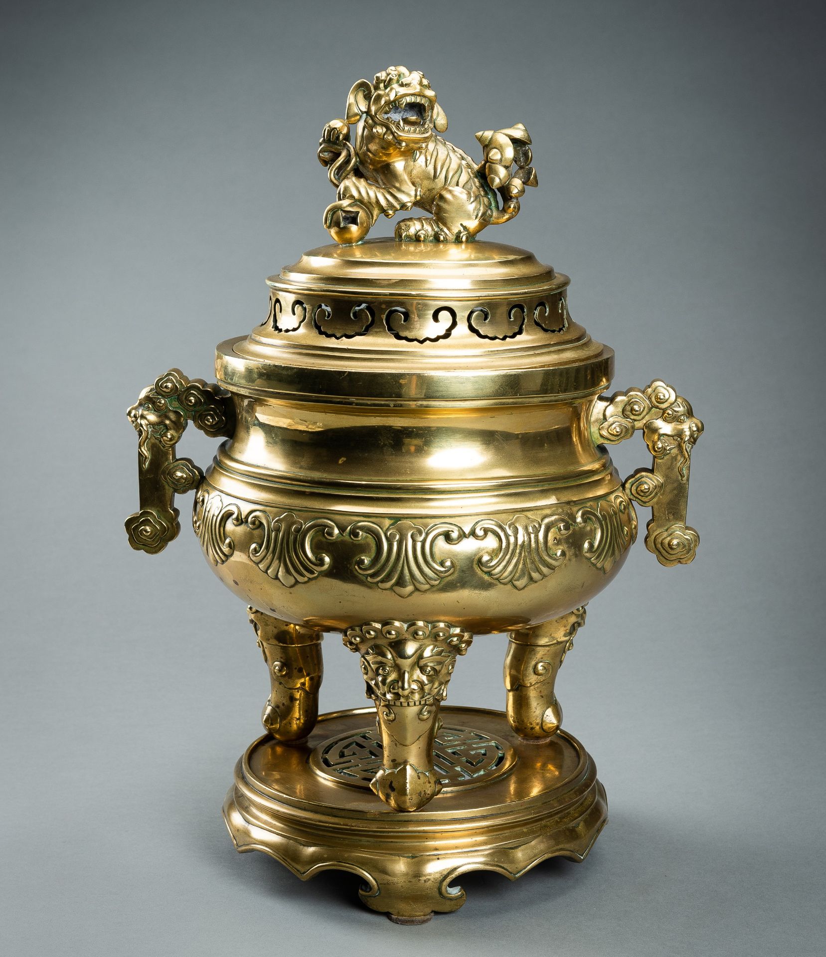 A MASSIVE GILT BRONZE TRIPOD CENSER WITH STAND AND COVER, QING