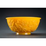 AN OPAQUE YELLOW GLASS BOWL WITH BUDDHIST SYMBOLS, QING