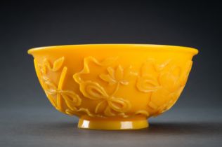 AN OPAQUE YELLOW GLASS BOWL WITH BUDDHIST SYMBOLS, QING