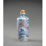 A BLUE, WHITE AND IRON RED 'SCHOLARS' PORCELAIN SNUFF BOTTLE, QING