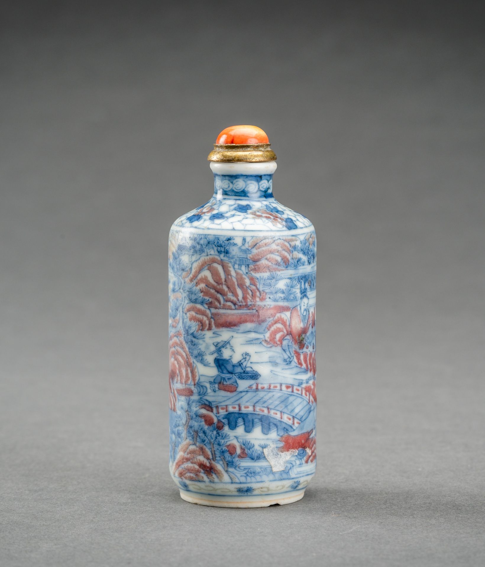 A BLUE, WHITE AND IRON RED 'SCHOLARS' PORCELAIN SNUFF BOTTLE, QING