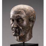 A ROMAN LIMESTONE PORTRAIT HEAD OF JULIUS CAESAR, AUGUSTAN PERIOD