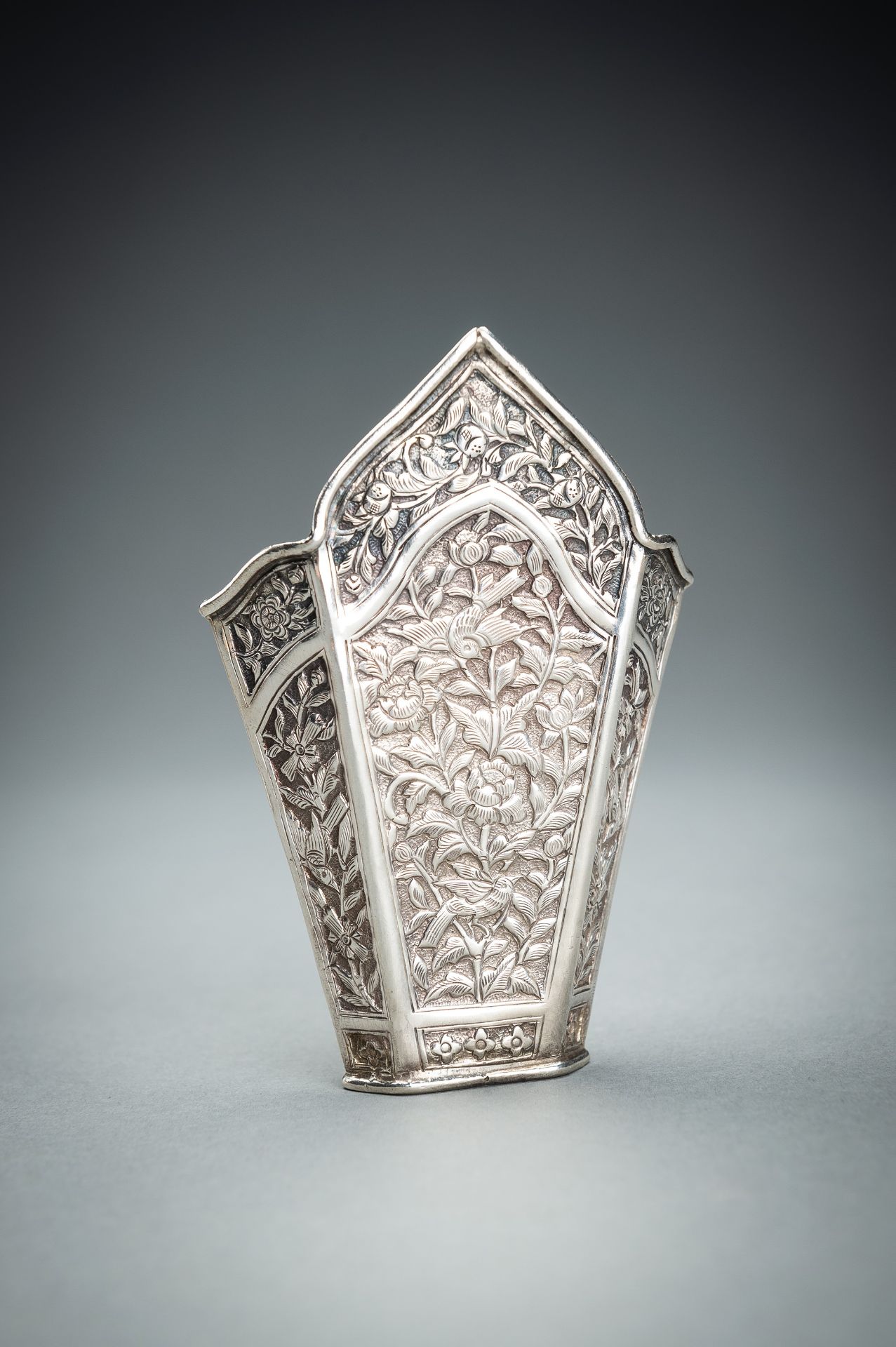 A GROUP OF FIVE EMBOSSED SILVER BETEL LEAF HOLDERS, c. 1900s - Image 11 of 19