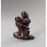 A ZITAN WOOD FIGURE OF A COUPLE IN EROTIC EMBRACE