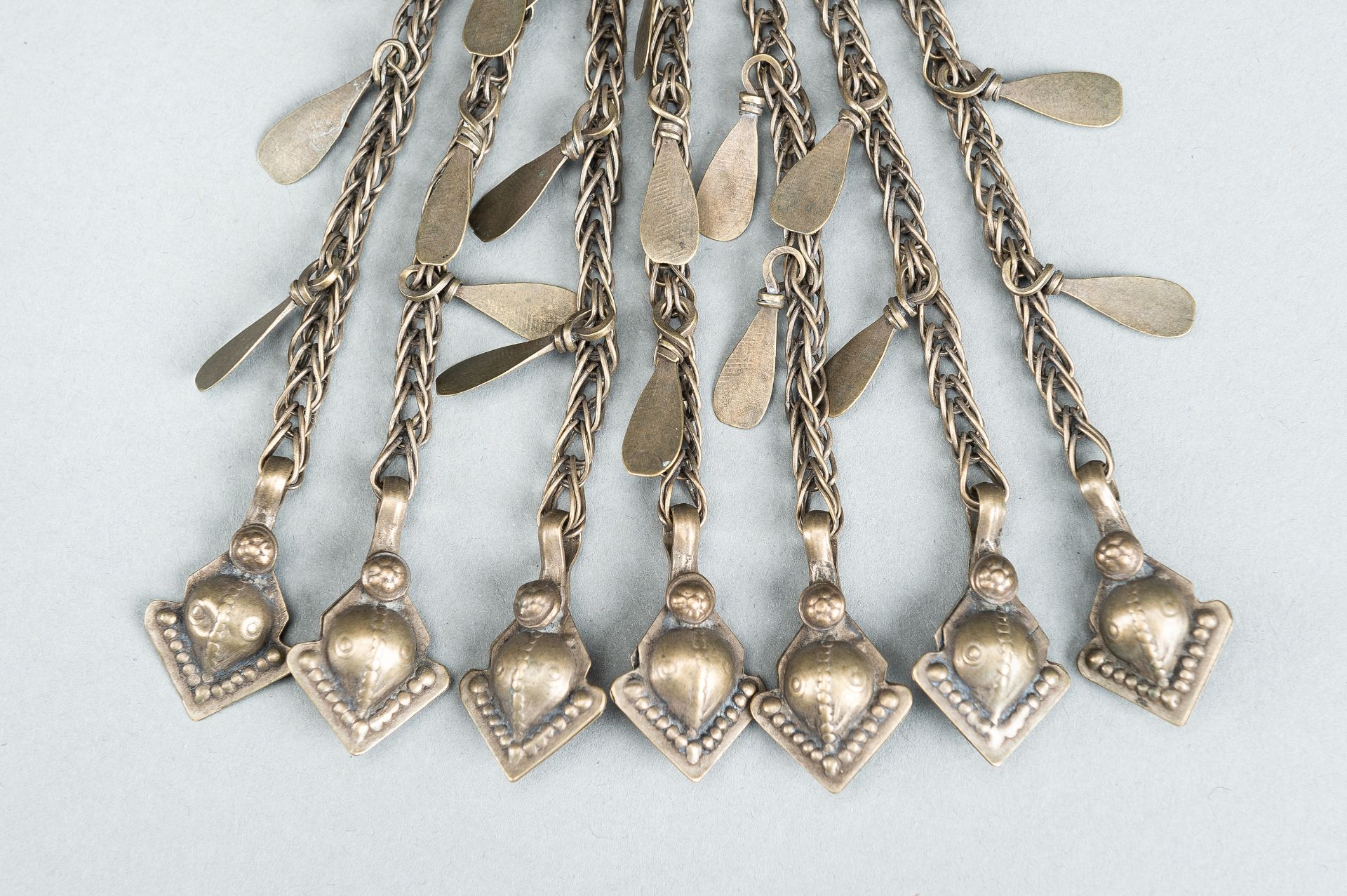 THREE TRIBAL AFGHAN METAL ORNAMENTS WITH INSETS, c. 1950s - Image 13 of 16