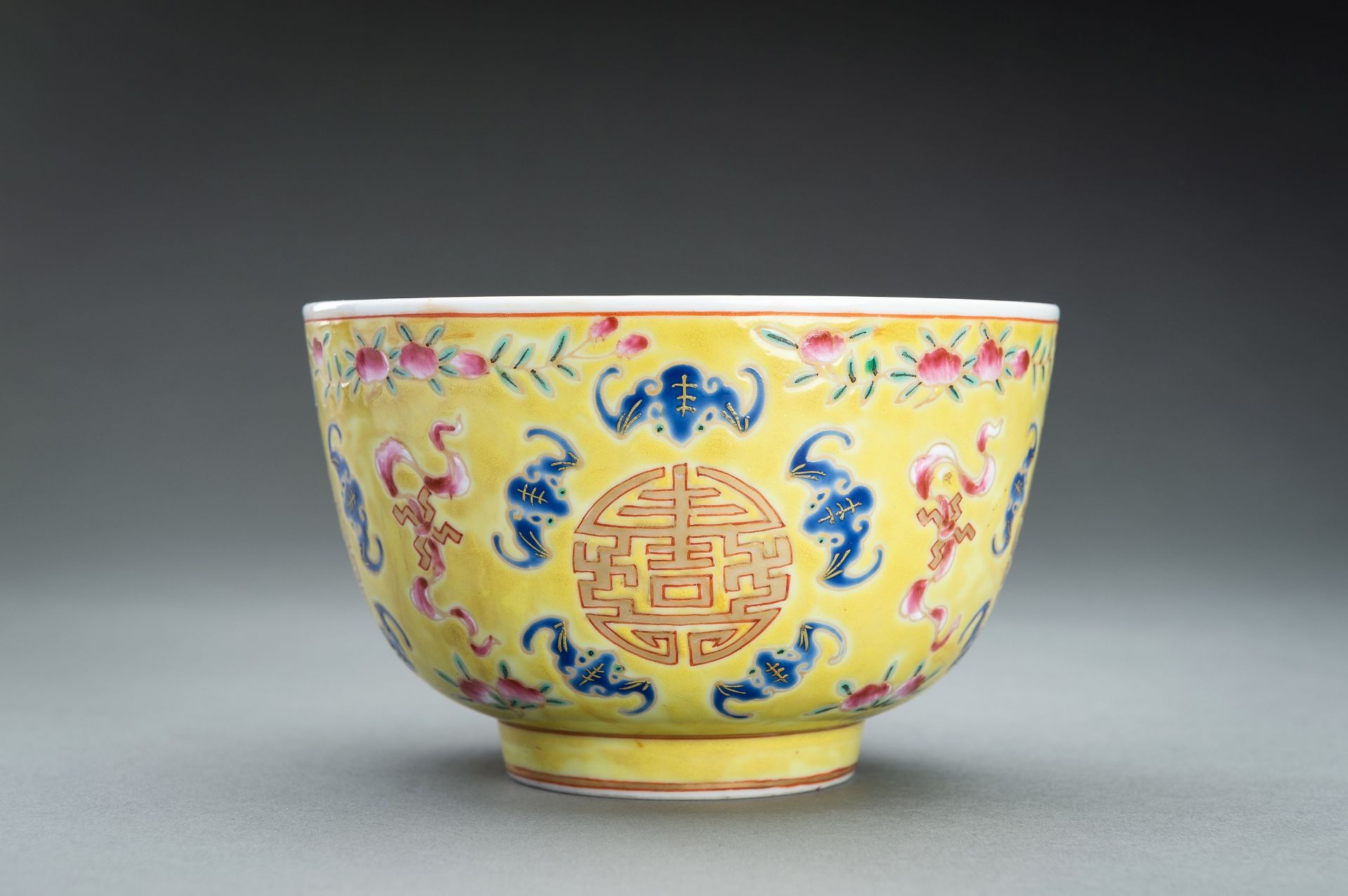 AN ENAMELED 'LOTUS AND SHOU' BOWL, TONGZHI MARK AND PROBABLY OF THE PERIOD